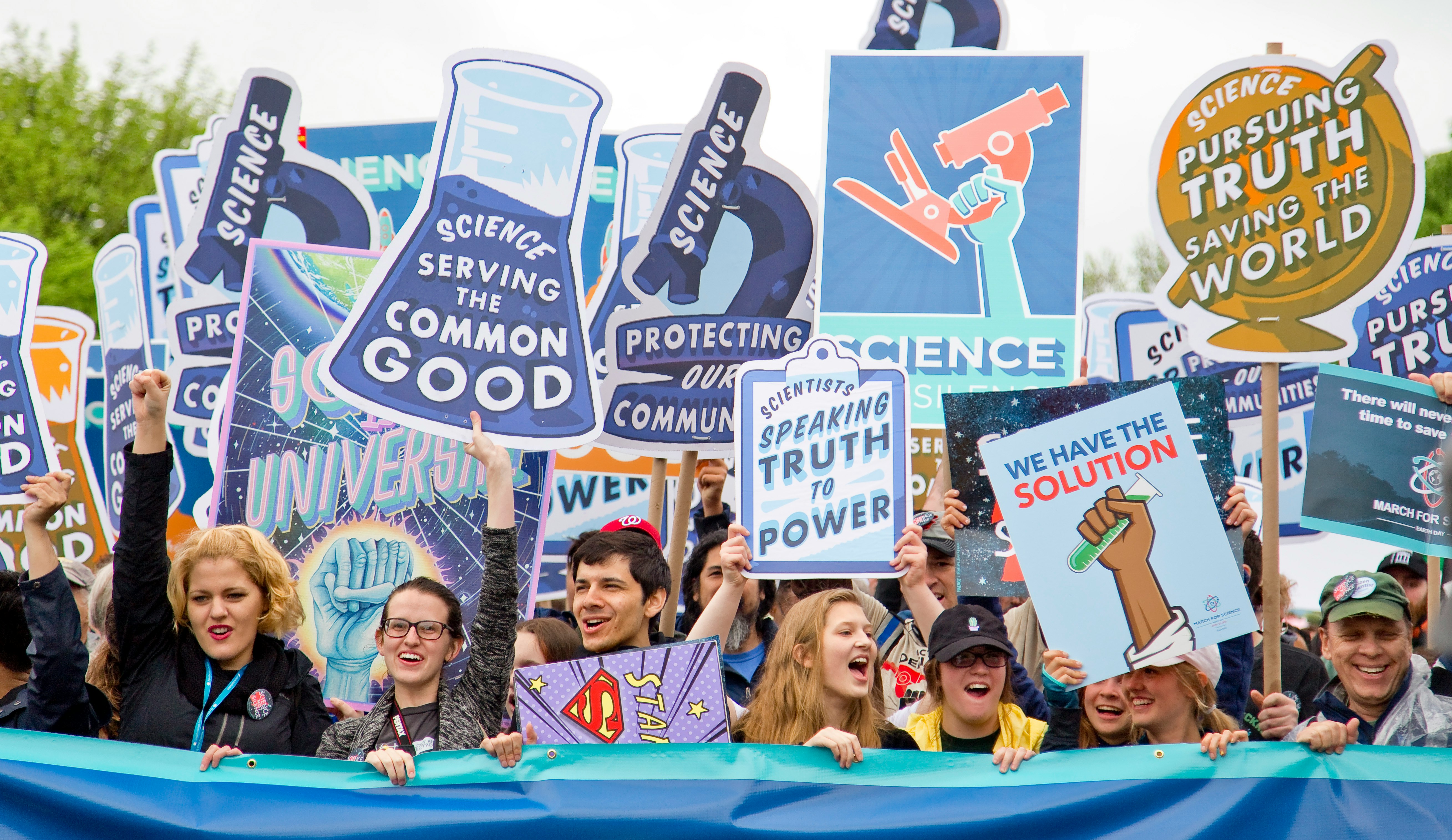 group of people with signages